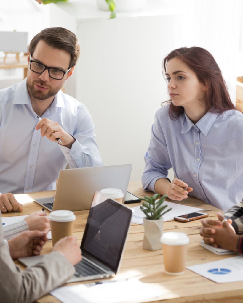 Millennial,Businessman,In,Glasses,Head,Casual,Office,Meeting,Talking,To